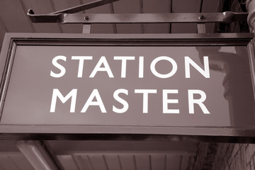 Green Station Master Sign on Railroad Platform