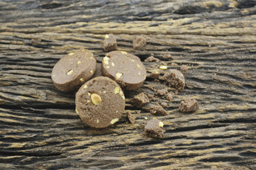 Chocolate cookies on old wooden background