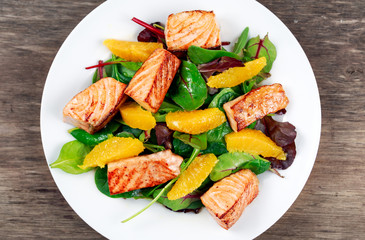 Fresh Salmon Salad with vegetables and orange.