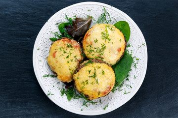 Cooked Mushrooms with vegetables and cheese.
