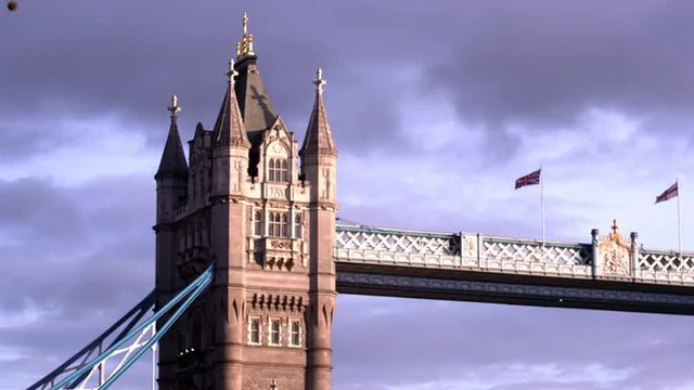 Close up low angle view of the top of one of the towers on Tower Bridge in London, England.