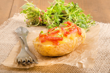 baked potato with cheese, bacon and sweet basil