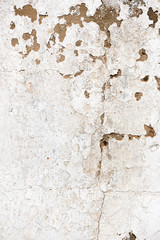 Old, grungy white background of natural plaster wall surface.