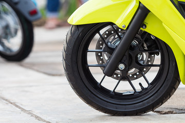 Close up front wheel of motorcycle.