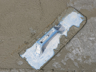 trowel and wet cement