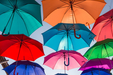 Fototapeta na wymiar Umbrella floating in the blue sky