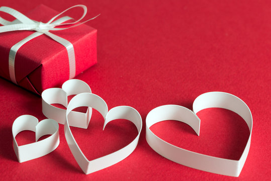 Red gift box with heart shape symbol