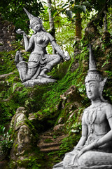 Fototapeta premium Thailand. Closeup Of Magic Secret Buddha Garden Stone Statues In Koh Samui. Figures Of Human And Deities Dancing And Playing. Place For Relaxation And Meditation. Buddhism. Travel To Asia, Tourism. 