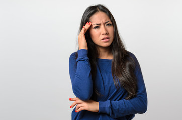 Fototapeta premium Young woman suffering from a headache