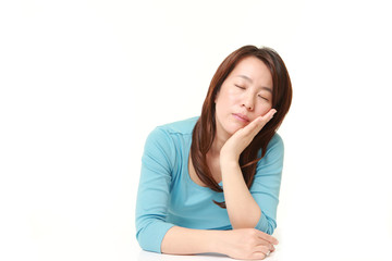 Fototapeta premium Japanese Woman Sleeping on the Table 