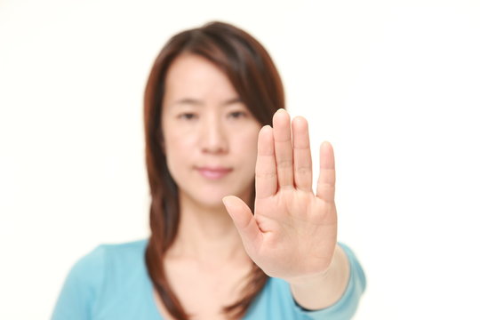 Japanese woman making stop gesture