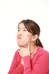 Japanese woman having throat pain