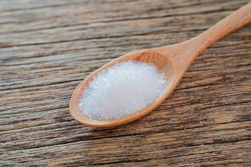 Monosodium glutamate,Wooden spoon,Wooden floor.