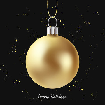 Greeting card with golden Christmas ball