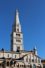 Fototapeta na wymiar MODENA, ITALY - JANUARY 10, 2016: Ghirlandina bell tower and Modena Cathedral, world heritage site