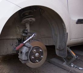 Car wheel on car repair station. 