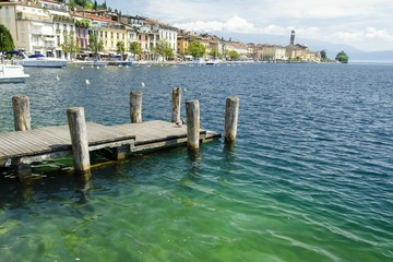 beautiful view on Salò with pier at Lake Garda, Italy