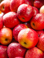 Fototapeta na wymiar Background of fresh red apple with drop