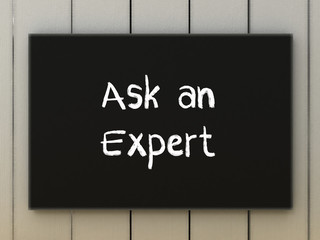 Ask an expert on black board. Business concept.
