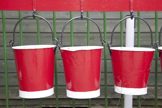 Closeup of Three Red Hanging Buckets