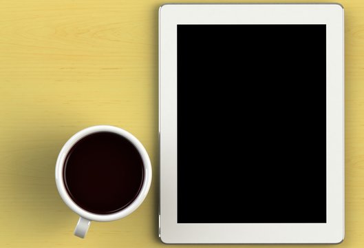 Coffee Cup With Tablet On Yellow Wood Table