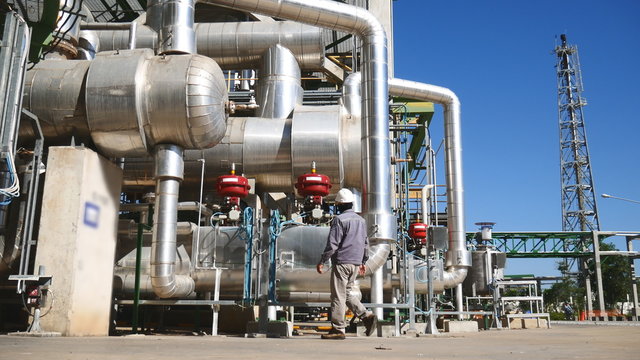 Engineer working in process area of oil refinery plant