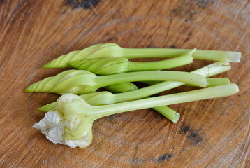Chinese paper flower on wooden chopping block