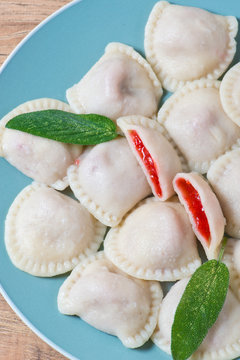 Traditional homemade dumplings with fresh strawberries