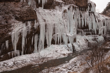 Beautiful winter landscape of frozen waterfalls in the Gorge of Chegem, the Republic of...