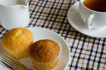 Butter Cup Cake and A Cup of Tea with Milk for Tea Break.