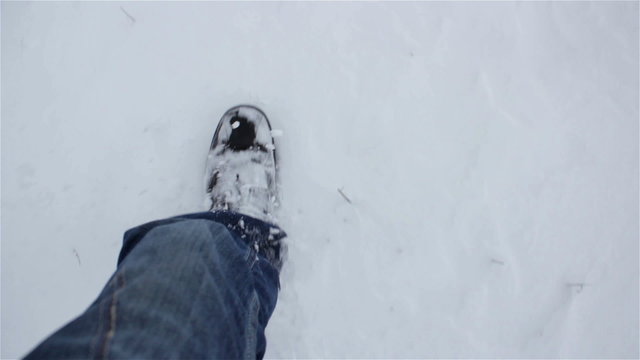 legs go on snow/wander winter snow making moves legs and shoes in the snow