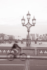 Westminster Bridge Lamppost; London in black and White Sepia Tone with Cyclist