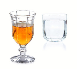 whiskey before meal and drinking water on white background