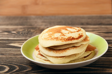 stack of pancakes on wooden board