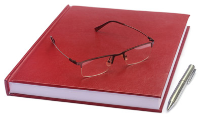 Maroon colored thesis paper with spectacles