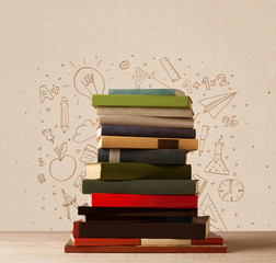 A pile of books on table with school hand drawn doodle sketches