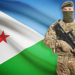 Fototapeta premium Soldier with machine gun and flag on background - Djibouti