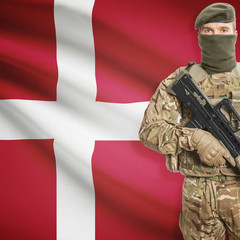 Soldier with machine gun and flag on background - Denmark