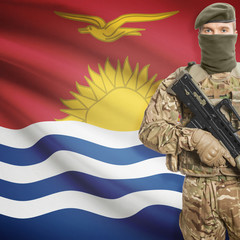 Soldier with machine gun and flag on background - Kiribati