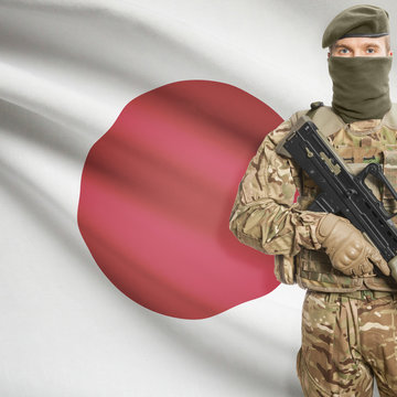Soldier with machine gun and flag on background - Japan