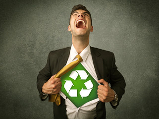 Enviromentalist business man tearing off shirt with recycle sign