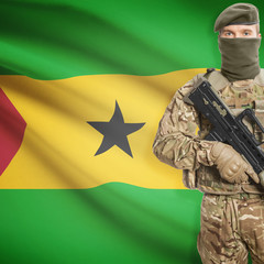 Fototapeta premium Soldier with machine gun and flag on background - Sao Tome and Principe