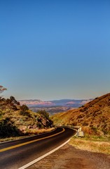 Old tool rusting on a wooded fence.