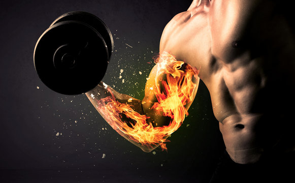 Bodybuilder athlete lifting weight with fire explode arm concept