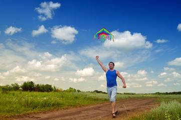 Boy flying a kite in a field