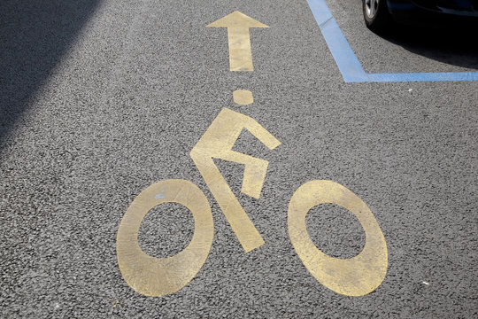 Cycle Lane Symbol painted on Street with Car