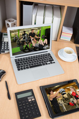 Close up photo of a fitness people in a screen of laptop