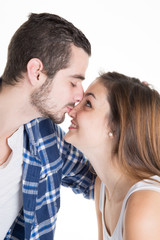 Young couple in love kissing isolated on white background