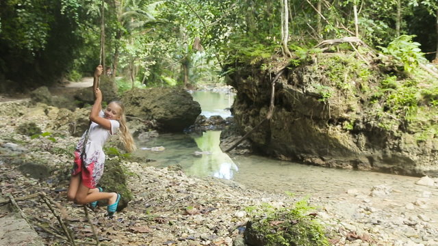 children girl playing with liana 