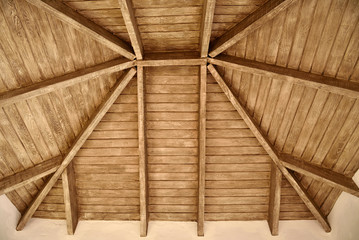 The exposed wooden ceiling